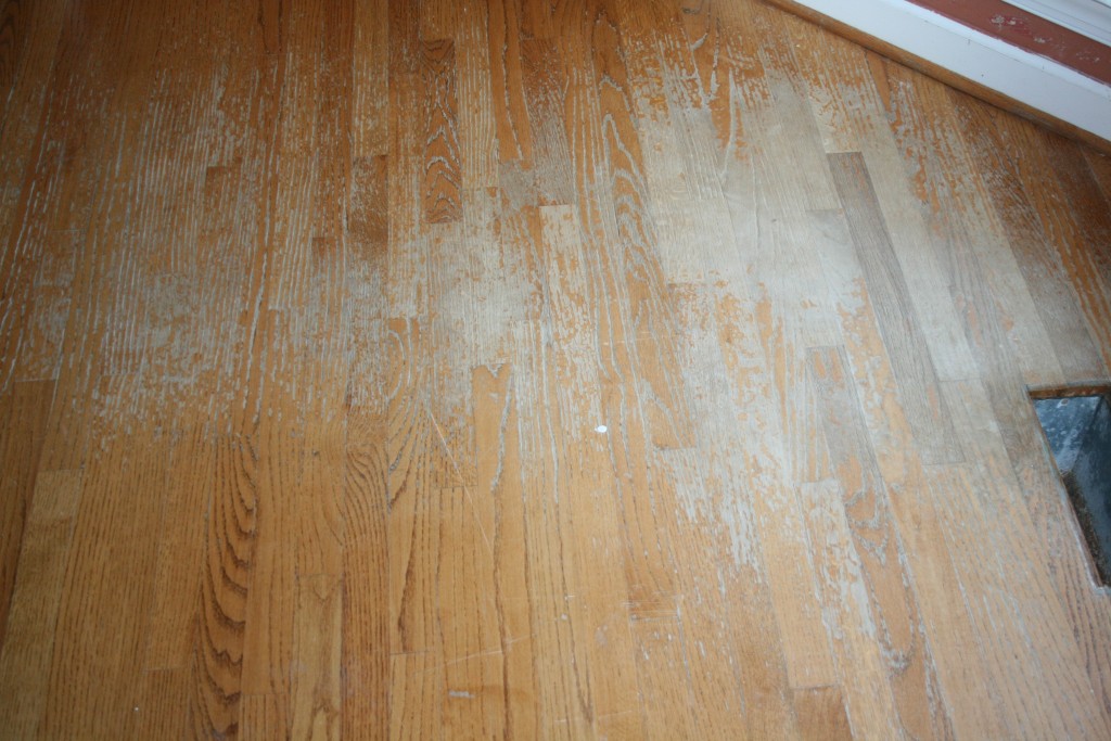 Image of wood finish worn away by foor traffic