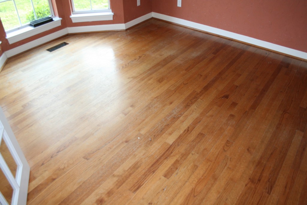 Image of wood floor with color issues caused by worn finish